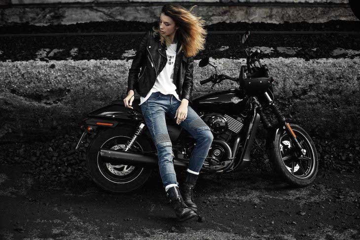 Woman siting on her Harley Davidson and wearing motorcyclist dyneema jeans