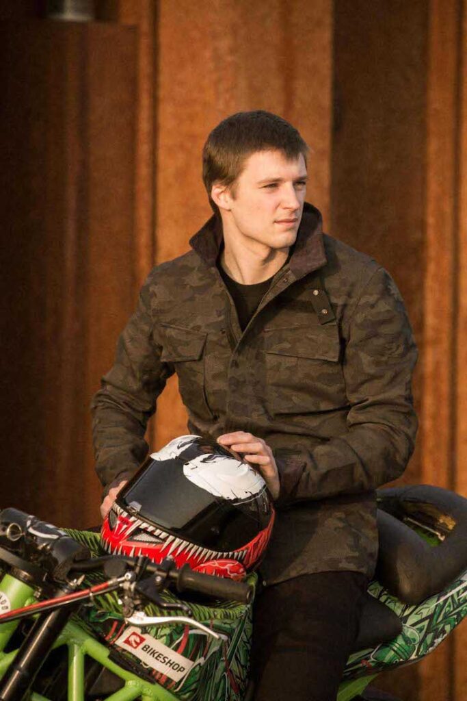 Paulius Labanauskas sits on his bike in a camo Pando Moto dyneema jacket