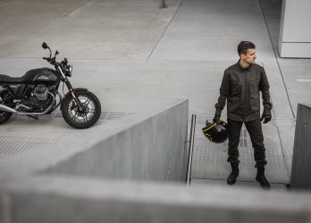 man with a motorcycle and motorcycle accessories