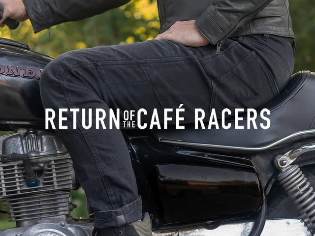 Close-up of Boss Dyn 01 riding jeans leg on café racer bike with ‘Return Of The Cafe Racers’ branding—emphasizes texture and context.