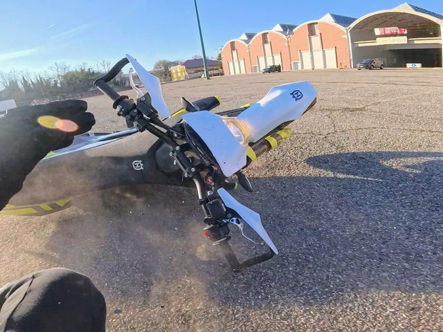 Motorcycle sliding out during failed wheelie.