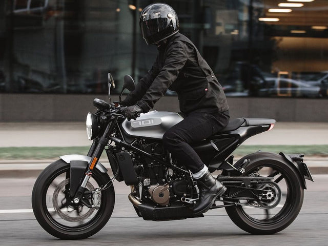 A rider wearing a full Pando Moto gear set, illustrating the importance of choosing proper motorcycle gear for safety.