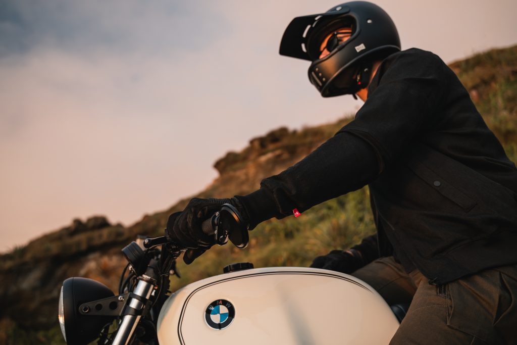man with BMW motorbike learning how to ride a motorcycle 
